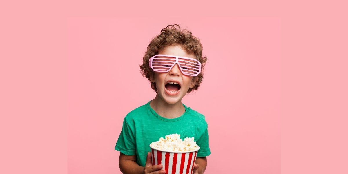 kid with popcorn
